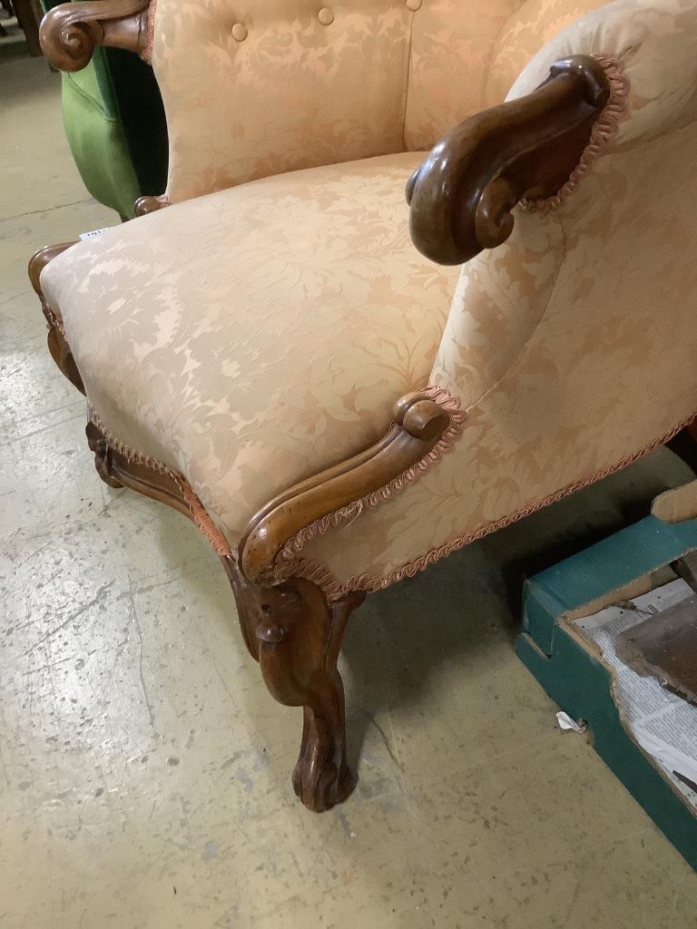 A Victorian walnut button back armchair, width 77cm